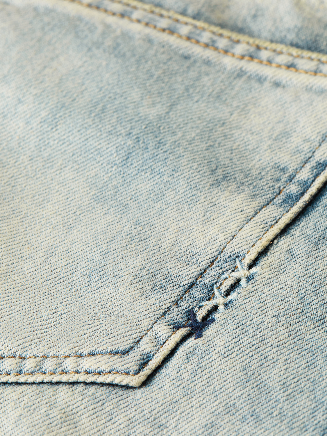 Deep loose-fit denim jeans by SCOTCH & SODA featuring S&S x Basquiat design, shown with distressed details and classic five-pocket style.