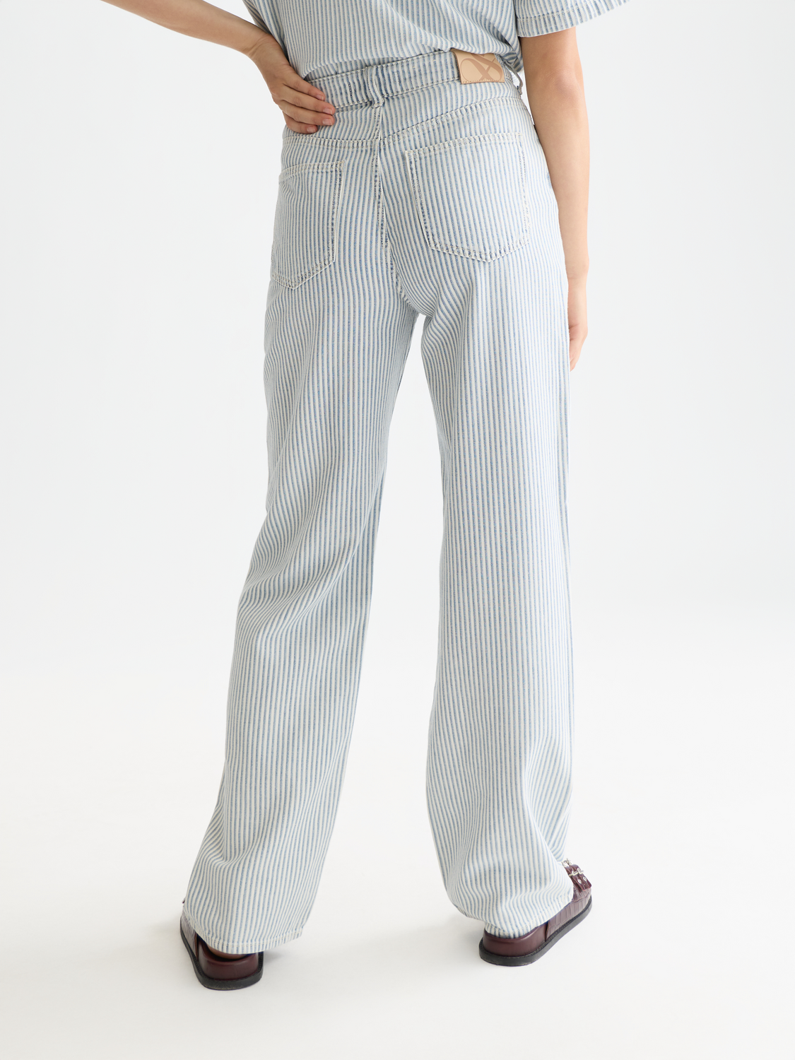 Ripple straight-fit denim jeans by Scotch & Soda, shown from the back with a classic blue wash and tailored fit.