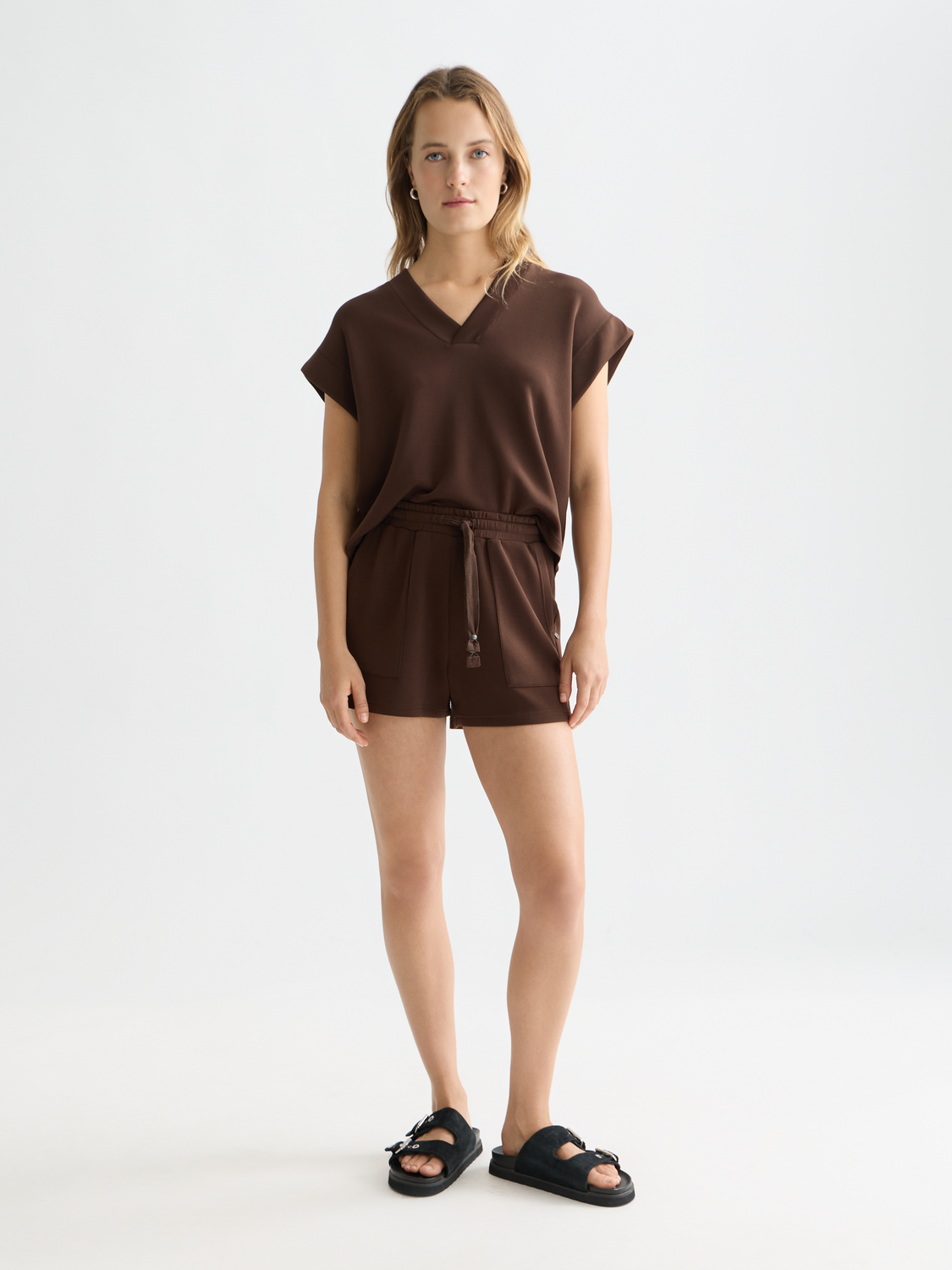 Light blue Tencel shorts from Scotch & Soda with a relaxed fit and subtle stitching detail, displayed on a model.