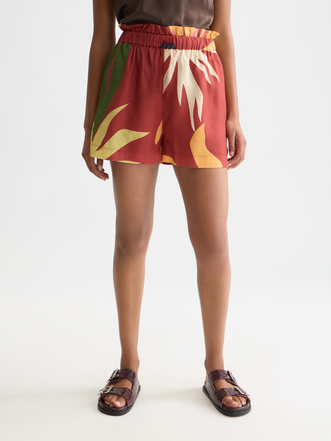 Printed shorts by Scotch & Soda featuring vibrant floral and geometric patterns, casual fit, and lightweight fabric.