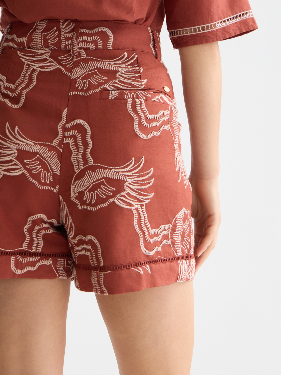 Embroidered shorts by Scotch & Soda featuring colorful floral embroidery, casual fit, and lightweight fabric.