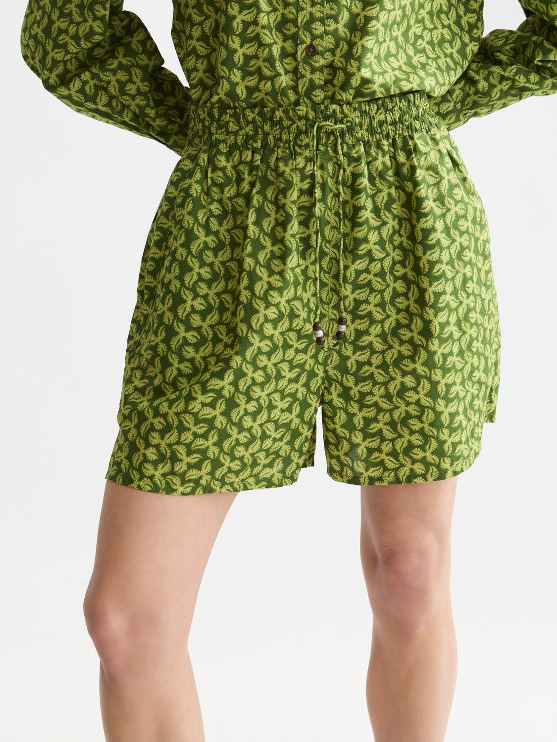 Printed shorts by Scotch & Soda featuring vibrant patterns, shown laid flat with a focus on the colorful design.