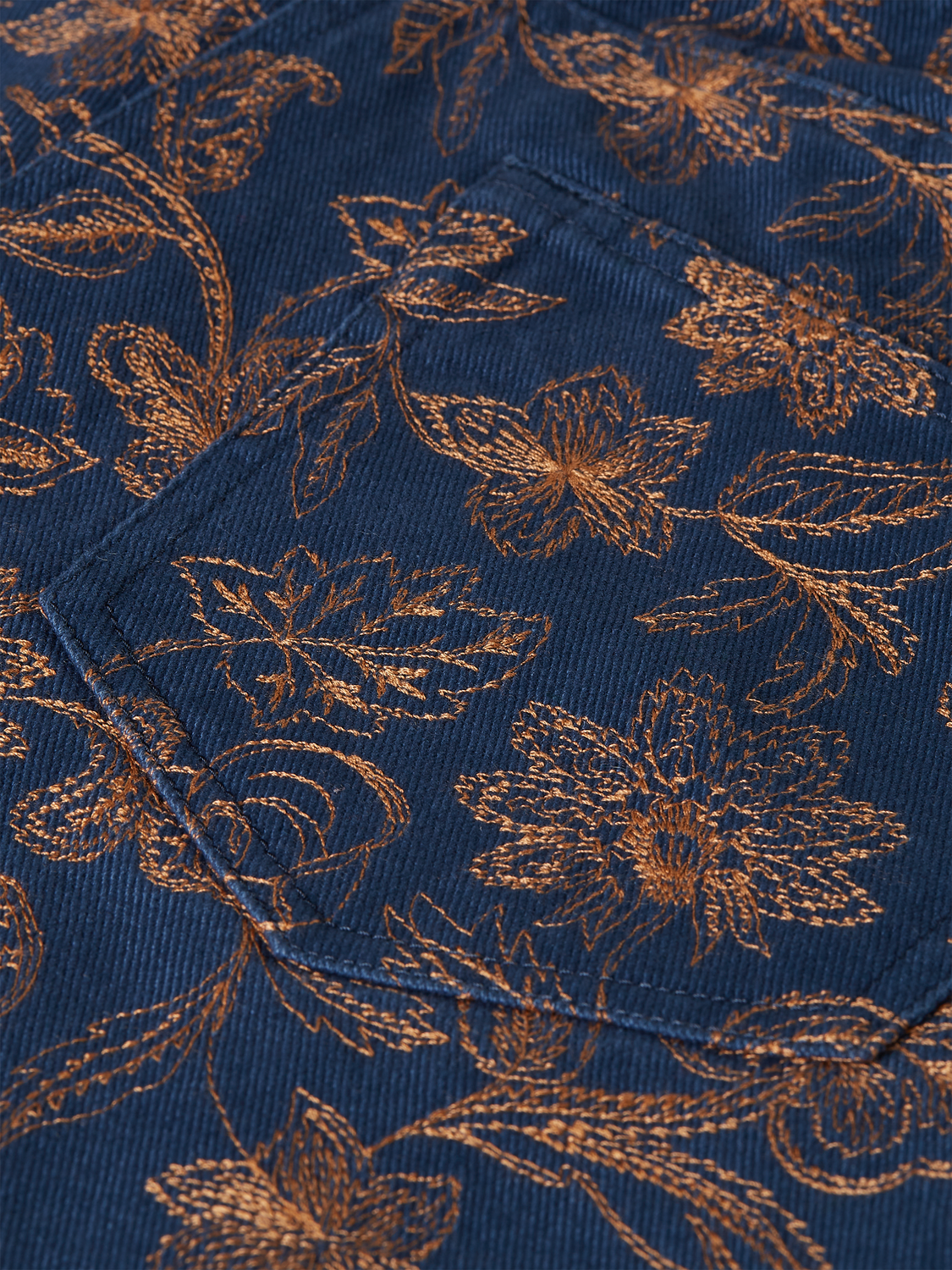 Embroidered shorts by Scotch & Soda featuring detailed stitching and a casual fit, shown in a close-up view.