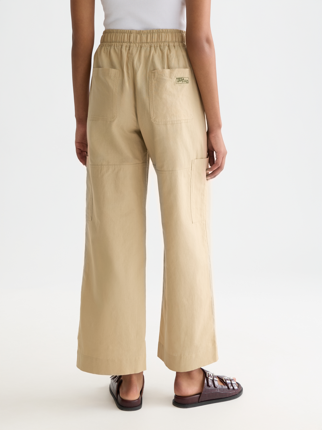Wide-fit Noa pants by Scotch & Soda, shown from the back with a crêpe fabric and relaxed silhouette.