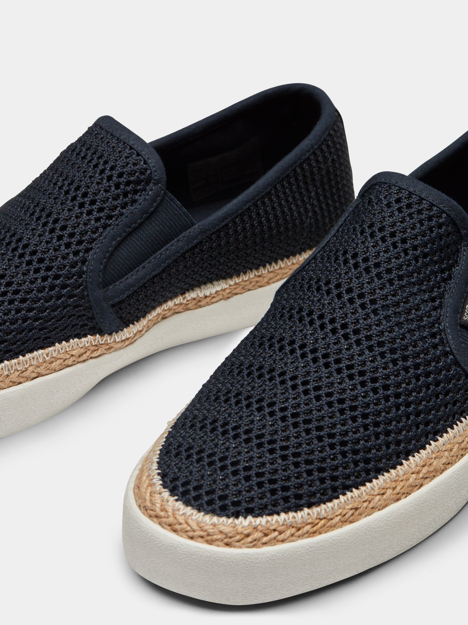 Scotch & Soda Izomi slip-on shoe in neutral tones, featuring a sleek design and comfortable footwear style.